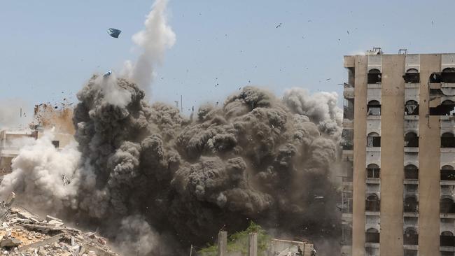 Smoke and debris rise following an Israeli strike on a house west of Jabalia, in the northern Gaza Strip, on June 1, 2025, amid the war between Israel and the Palestinian Hamas militant movement. (Photo by BASHAR TALEB / AFP)
