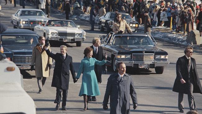 Jimmy Carter and first lady Rosalynn Carter walk down Pennsylvania Avenue after Mr Carter was sworn in as the US’s 39th president in 1977. Picture: AP