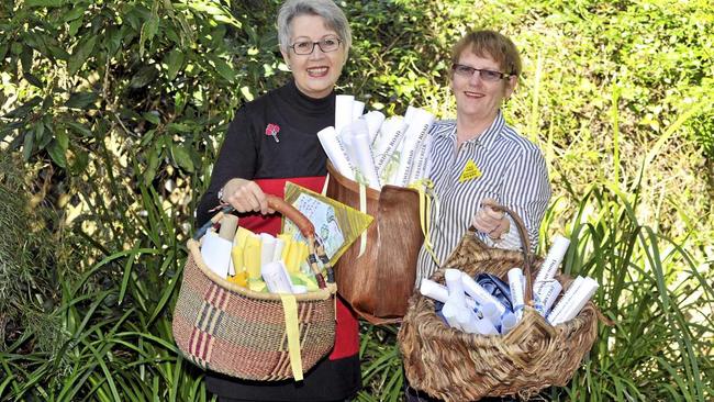 Lismore Mayor Jenny Dowell and Annie Kia with baskets full of CSG Free Community declarations. Picture: Mireille Merlet-Shaw