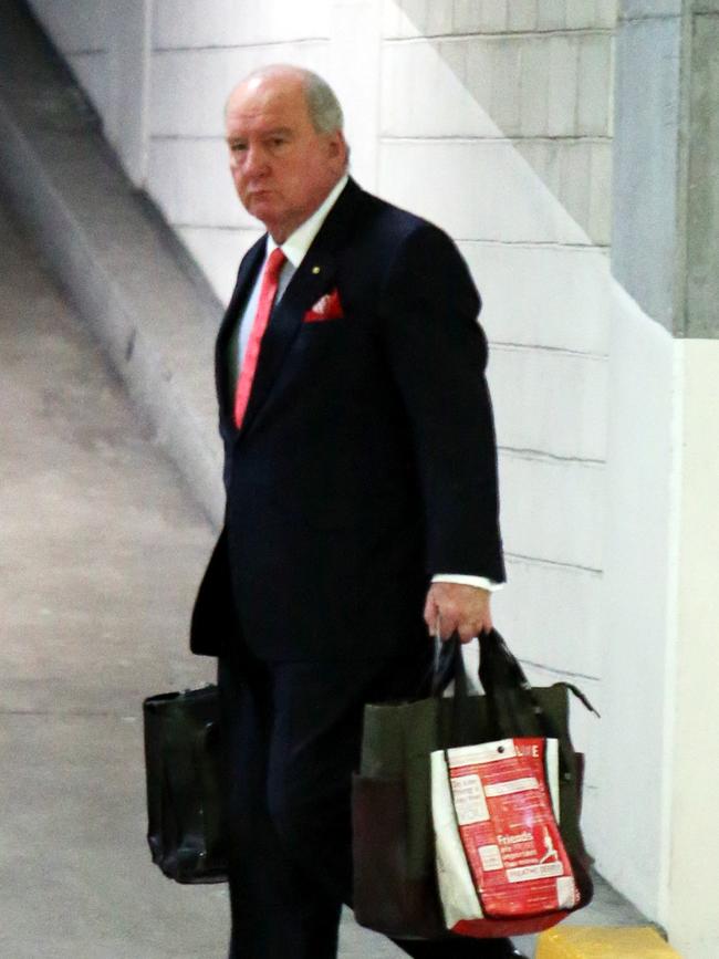 Radio presenter Alan Jones looks dejected arriving for work after creating controversy on his program about Prime Minister Julia Gillard.