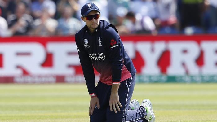 England's Joe Root watches the ball on his knees during the ICC Champions Trophy semifinal cricket match between England and Pakistan at The Cardiff Stadium in Cardiff, Wales Wednesday, June 14, 2017. (AP Photo/Kirsty Wigglesworth)