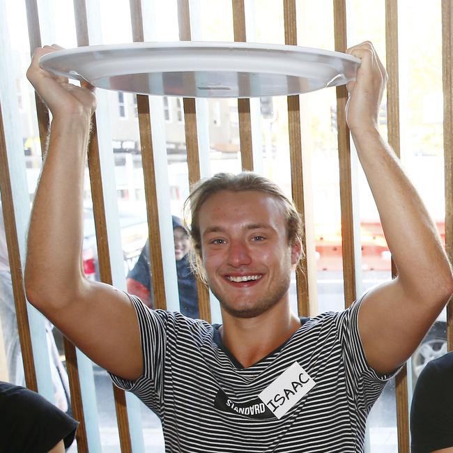 Winner Isaac Harding-Davis with an empty plate, a gut full of rice and fish and stuff and a heart full of pride knowing that he can eat food really quickly. Pictures: John Appleyard