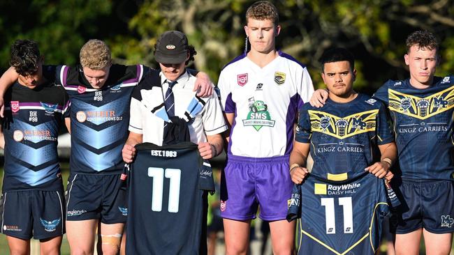 Caloundra and Mabel Park players stand together for a moment of silence. Pic: Kylie McLellan