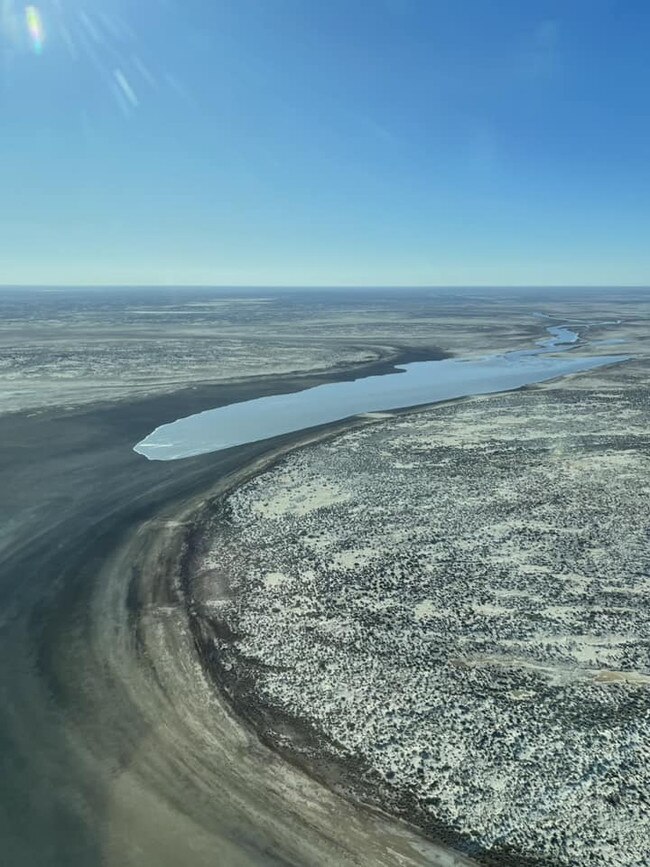 Flood waters travel through Channel Country in the far northeast of South Australia heading towards Lake Eyre. Picture: Wrights Air