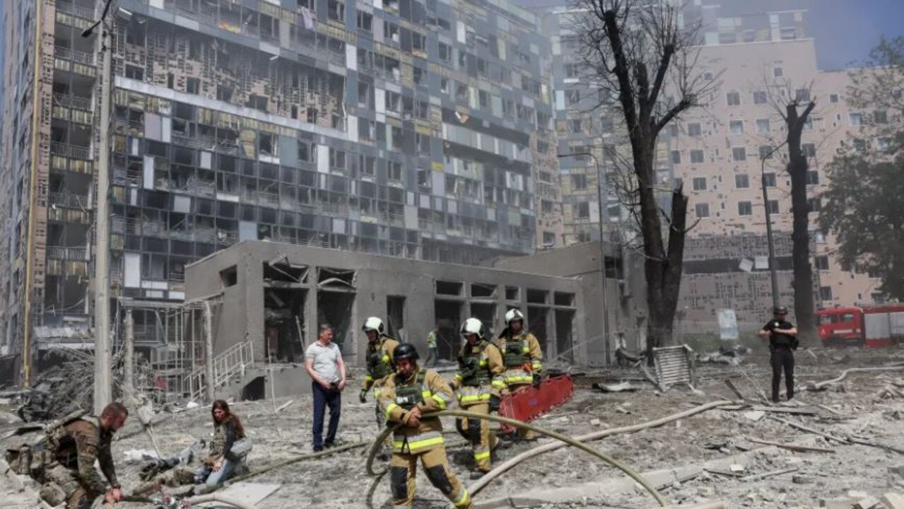 Firefighters at the site in Kyiv. Credit: Reuters