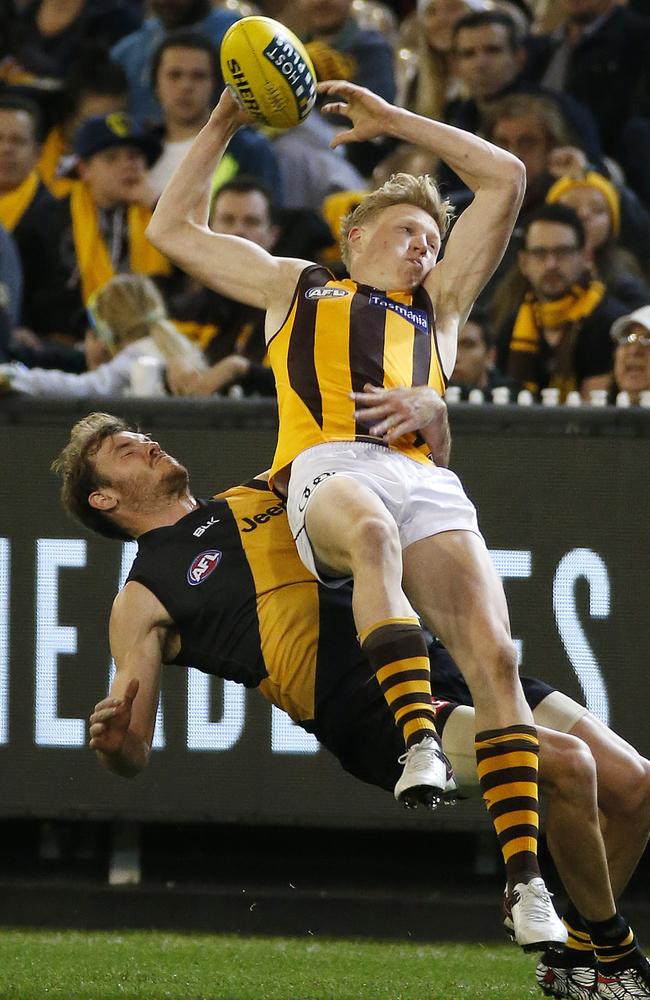 James Sicily takes a third-quarter mark over Kamdyn McIntosh. Picture: George Salpigtidis