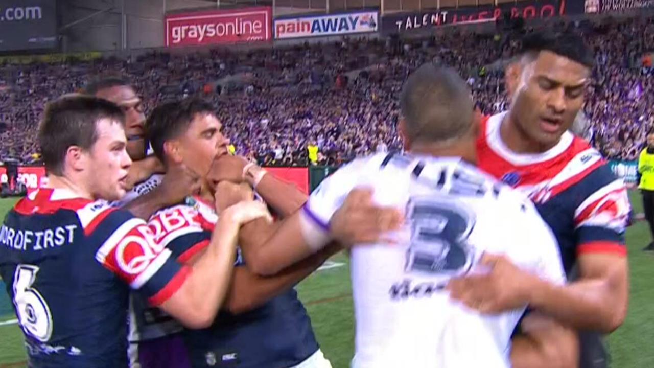 Latrell Mitchell and Will Chambers clash.