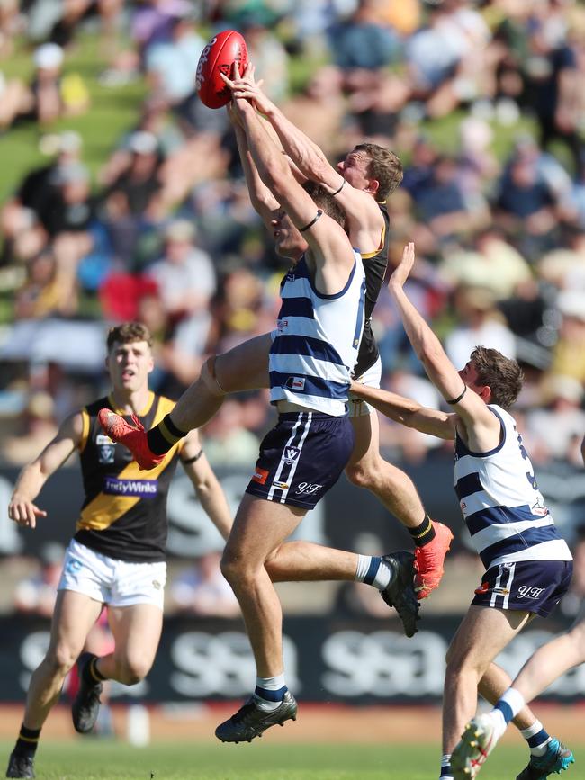 Albury’s Elliott Powell soars over Yarrawonga ruckman Lach Howe.