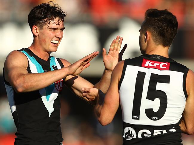 GOLD COAST, AUSTRALIA - JUNE 19: Connor Rozee of the Power celebrates a goal during the round 14 AFL match between the Gold Coast Suns and the Port Adelaide Power at Metricon Stadium on June 19, 2021 in Gold Coast, Australia. (Photo by Chris Hyde/Getty Images)