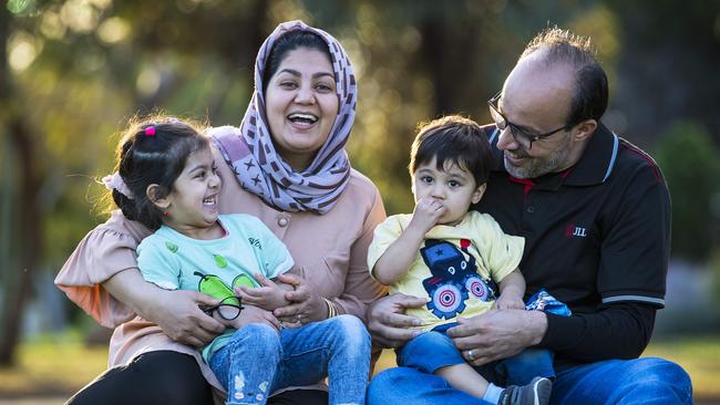 Afghan refugees Jawid and his wife Nazifa with their children Marwa, 3, and Hamza, 20 months, in a local park not far from the northern suburbs home they are temporarily occupying as they find their feet. Picture Mark Brake