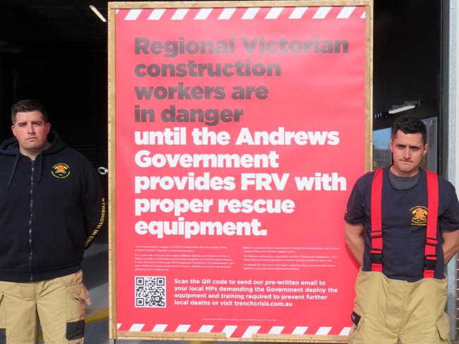 Firefighters at Lucas Fire Station beside a union campaign poster.