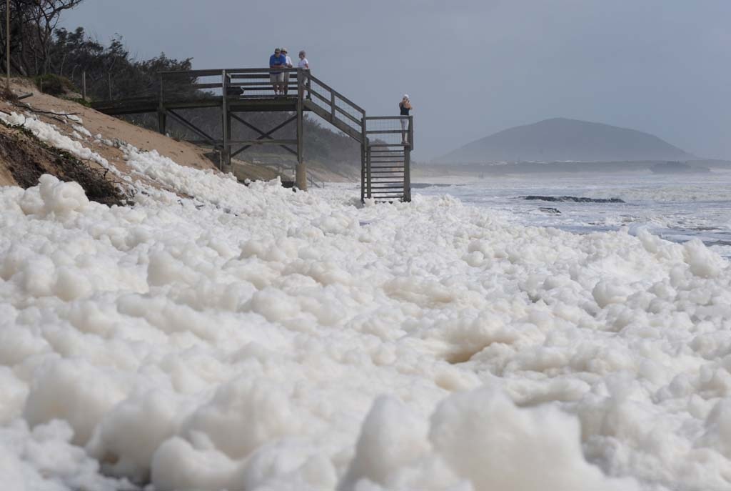 Foam covers Maroochydore Beach after heavy rain and large seas. Picture: Brett Wortman