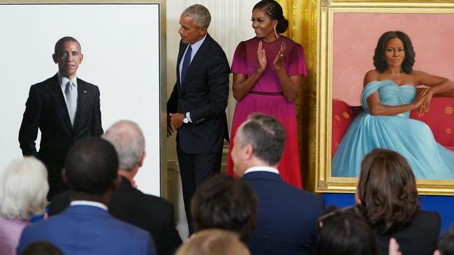 Barack Obama and wife Michelle Obama take part in the unveiling of the their official White House portraits in the East Room of the White House. Picture: AFP.