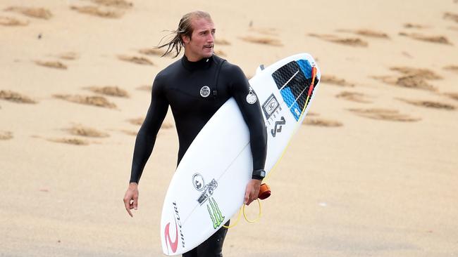 Bells Beach Owen Wright (Australia) exits the water after a practice surf at Bells Beach ahead of his quarter final match up against fellow Australian Josh Kerr. Picture: Jason Sammon Wednesday 8th April 2015