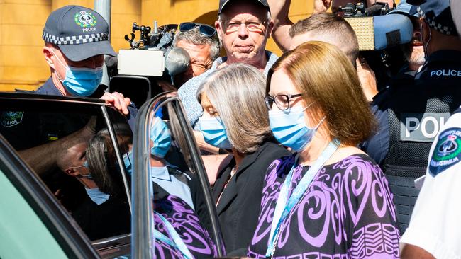 SA chief public health officer Nicola Spurrier is flanked by police as anti-vaccine protesters surround her leaving Adelaide Supreme Court. Picture: NCA NewsWire / Morgan Sette