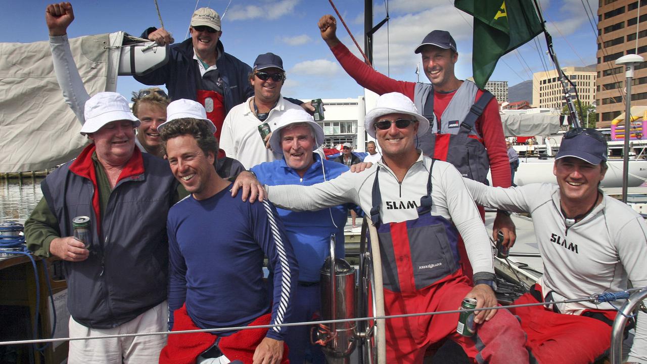 Lindsay May, centre in blue shirt, after winning the Sydney to Hobart overall.