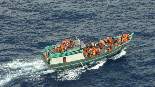 A boat with asylum-seekers approaches Christmas Island. Picture: AFP