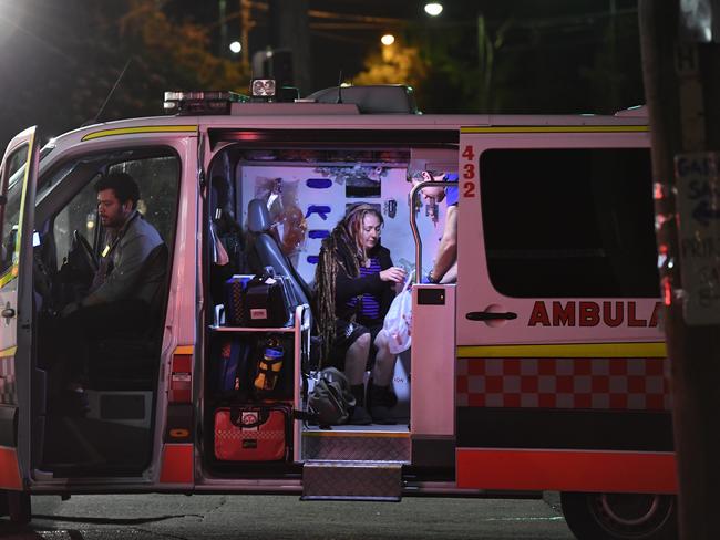 Sharon Hacker sits inside an ambulance following the attack which she told the has left her with nerve pain and inability to sleep through the night. Picture: Gordon McComiskie