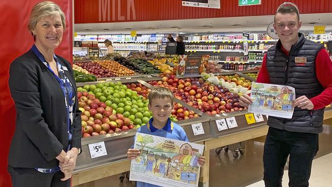 Kingscliff Public School principal Diana Foley, winning student Tommy Millar, 8, and Coles Casuarina store manager Mitch Springer.