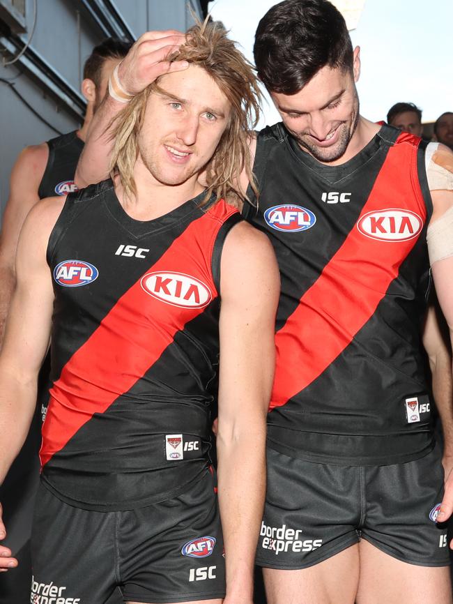 And he enjoyed the spoils of victory after the game with mate Patrick Ambrose. Picture: Alex Coppel.