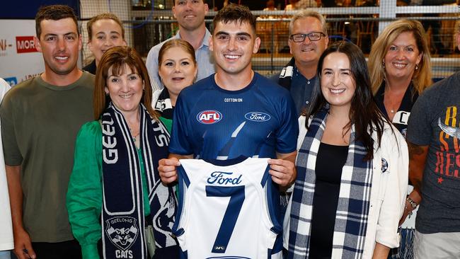 GEELONG, AUSTRALIA - MARCH 16: Shaun Mannagh of the Cats poses with friends and family after being presented with his jumper during the 2024 AFL Round 01 match between the Geelong Cats and the St Kilda Saints at GMHBA Stadium on March 16, 2024 in Geelong, Australia. (Photo by Michael Willson/AFL Photos via Getty Images)