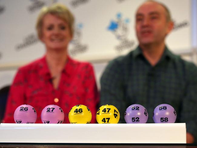 Millionaires ... Carol and David Martin with their winning numbers. Picture: Andrew Milligan/PA