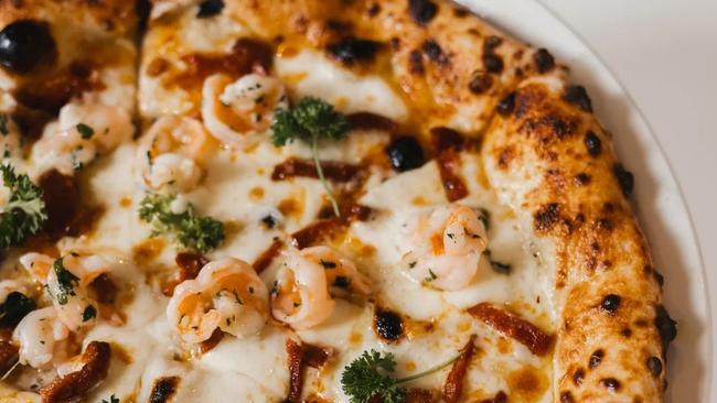 The garlic prawn and chorizo pizza from the newly opened La Milano Italian restaurant in Orange. Photo: Instagram / Supplied