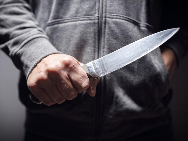 Generic crime Istock  -  Criminal with knife weapon threatening to stab
