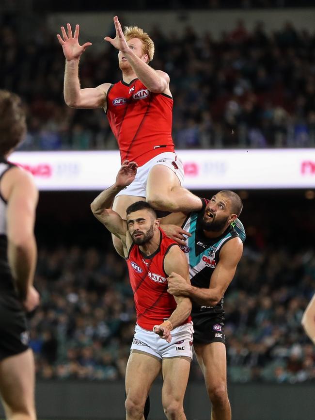 Aaron Francis takes a screamer over Adam Saad and Paddy Ryder.