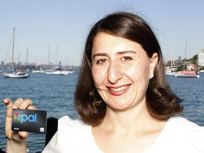 Gladys Berejiklian as NSW Minister for Transport with The Opal Card electronic ticketing card.