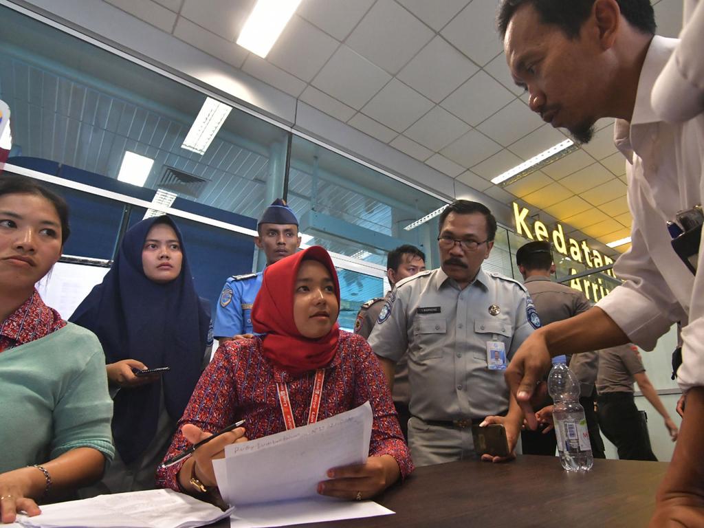 Family members wait for information at  Pangkal Pinang airport. Picture: AFP