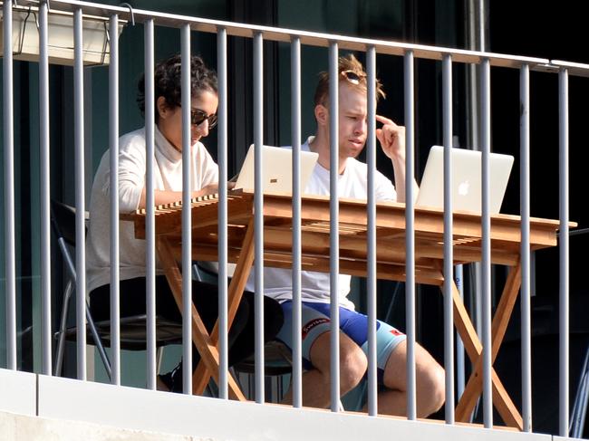 MELBOURNE, AUSTRALIA - NewsWire Photos AUGUST 10: Residents at this Collingwood apartment block enjoy some winter sun while working from home as stage 4 lockdowns come into effect across Melbourne. Picture: NewsWire / Andrew Henshaw