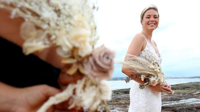 Newlywed Jess Vanslambrouck with her dried wedding bouquet. Picture: Toby Zerna