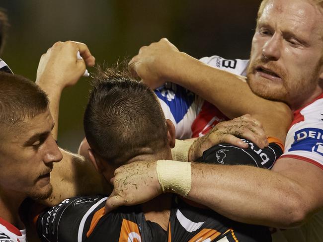 WOLLONGONG, AUSTRALIA - MARCH 15: Josh Reynolds of the Tigers scuffles with Dragons players after a Tigers try during the round 1 NRL match between the St George Illawarra Dragons and the Wests Tigers at WIN Stadium on March 15, 2020 in Wollongong, Australia. (Photo by Brett Hemmings/Getty Images)