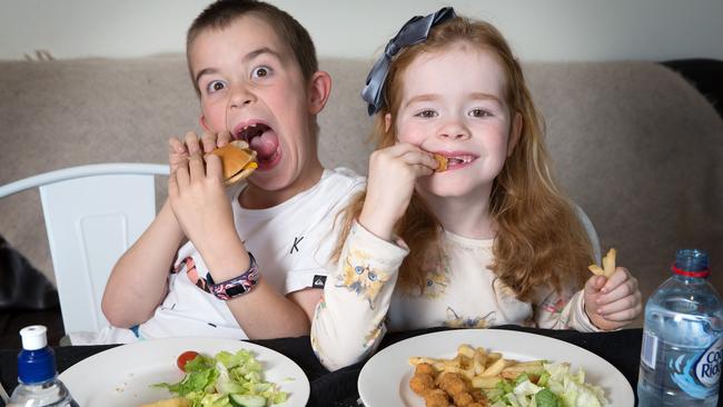 George and Poppy Shepherdson feast on fast food with healthy sides and water. Mum Sally says when they occasionally have fast food, she orders water. Picture: Sarah Matray