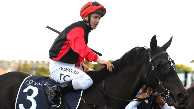 Tim Clark returns to the mounting yard after riding Con Te Partiro to victory in the Coolmore Legacy Stakes. Picture: AAP/Dan Himbrechts