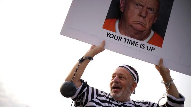 ‘Running America is not a reality show’: Domenic Santana ravelled from Miami to Washington to protest against the former president. Picture: AFP