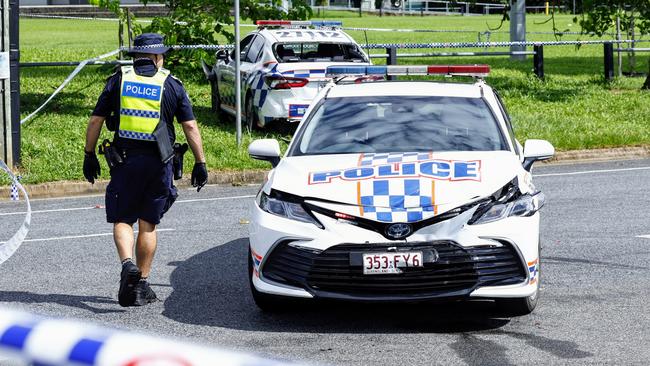 Police officers forensically inspect a crime scene at the intersection of Sondrio and Torino Streets, Woree, where a 21 year old male was shot by police officers after stealing a police car. Picture: Brendan Radke