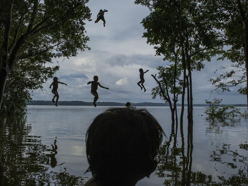 “Amazon’s Munduruku Tribe” by photographer Mauricio Lima for The New York Times which won second prize in the Daily Life singles category shows indigenous Munduruku children playing in the Tapajos river in the tribal area of Sawre Muybu, Itaituba, Brazil, Feb. 10, 2015. The tribesmen of the Munduruku, who for centuries have sanctified the Tapajos River on which their villages sit, are fighting for survival. Brazil’s government plans to flood much of their land to build a $9.9 billion hydroelectric dam, the Sao Luiz do Tapajos, as part of a wider energy strategy across the Amazon rainforest. (Mauricio Lima/The New York Times, World Press Photo via AP)