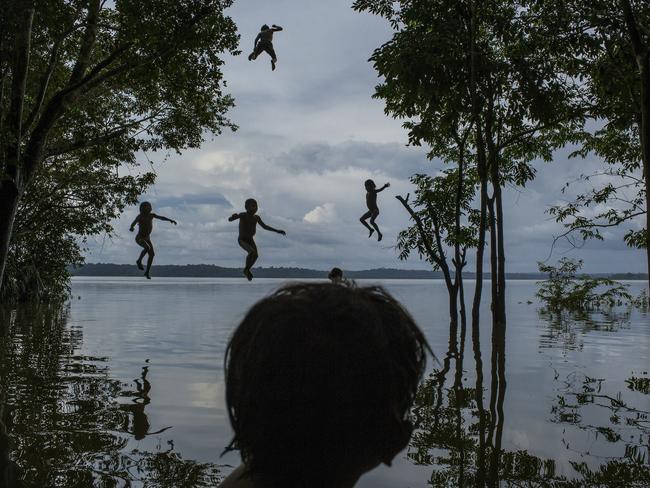 “Amazon’s Munduruku Tribe” by photographer Mauricio Lima for The New York Times which won second prize in the Daily Life singles category shows indigenous Munduruku children playing in the Tapajos river in the tribal area of Sawre Muybu, Itaituba, Brazil, Feb. 10, 2015. The tribesmen of the Munduruku, who for centuries have sanctified the Tapajos River on which their villages sit, are fighting for survival. Brazil’s government plans to flood much of their land to build a $9.9 billion hydroelectric dam, the Sao Luiz do Tapajos, as part of a wider energy strategy across the Amazon rainforest. (Mauricio Lima/The New York Times, World Press Photo via AP)