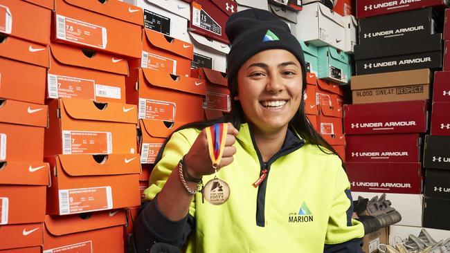 Celestina Dona at home in Mitchell Park, with her remarkable high end shoe collection (500 pairs) and Division one Dutschke Medal in 2021. Picture: Matt Loxton