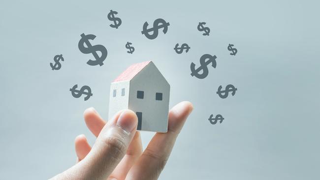 House model on human hands with dollar icon.Savings money and real estate concept. Property investing generic.