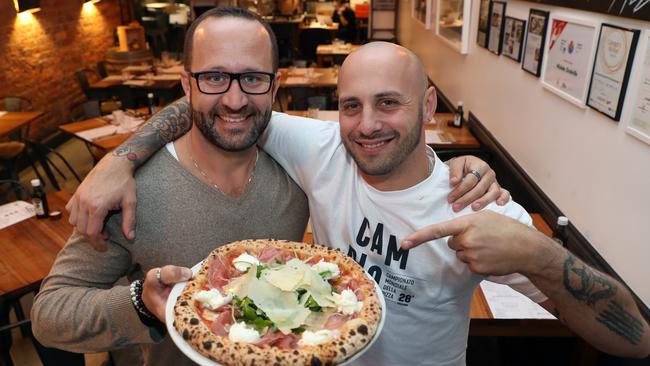 48H Pizza e Gnocchi South Yarra’s owners (L) Fabio Biscaldi and Michele Circhrillo with the winning pizza. Picture: David Crosling