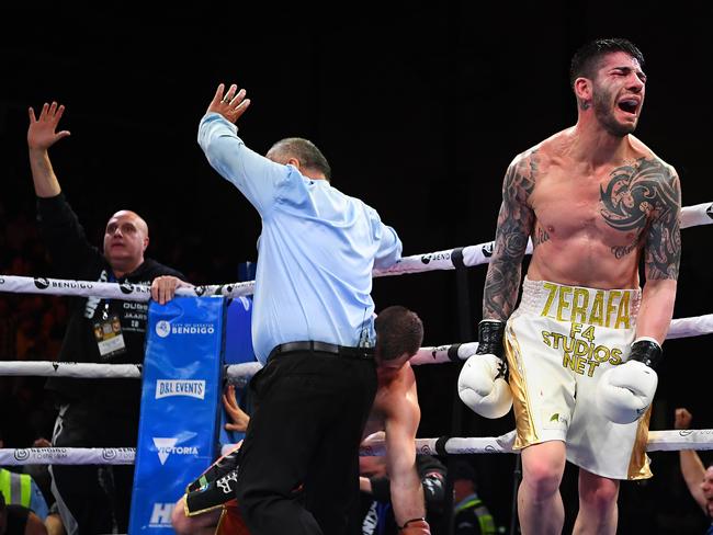 It’s all over … the referee stops the fight. Picture: Getty Images