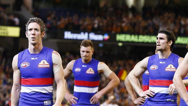 Disappointed Bulldogs players walk off the MCG after their 2015 Elimination Final loss. Picture: Michael Klein