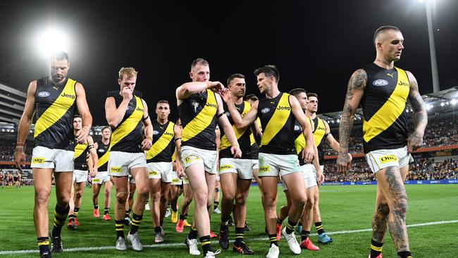 The Tigers walk off after they were defeated by the Lions. Picture: Quinn Rooney/Getty Images