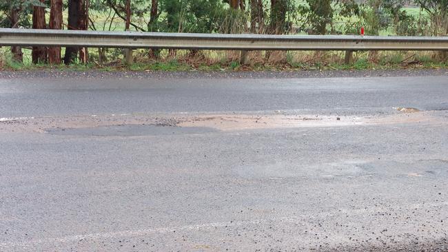 A rain filled pothole after recent heavy rain in Victoria. Photo: Supplied.