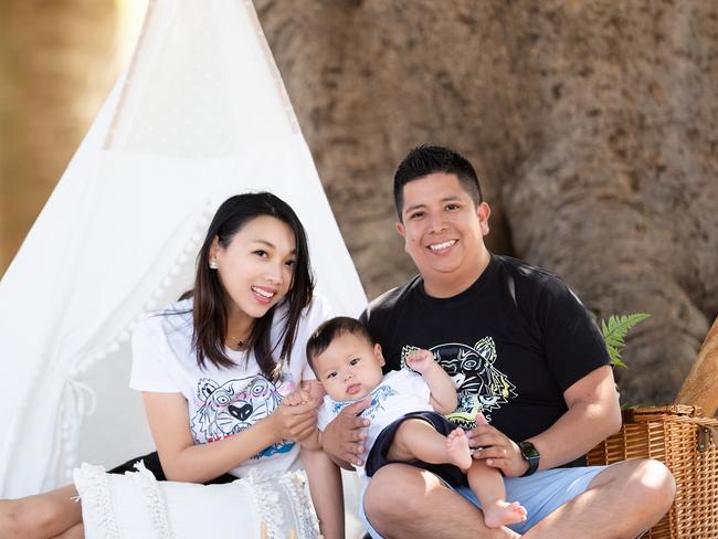 Kathleen Liang and Johann Castro, right, with baby George.