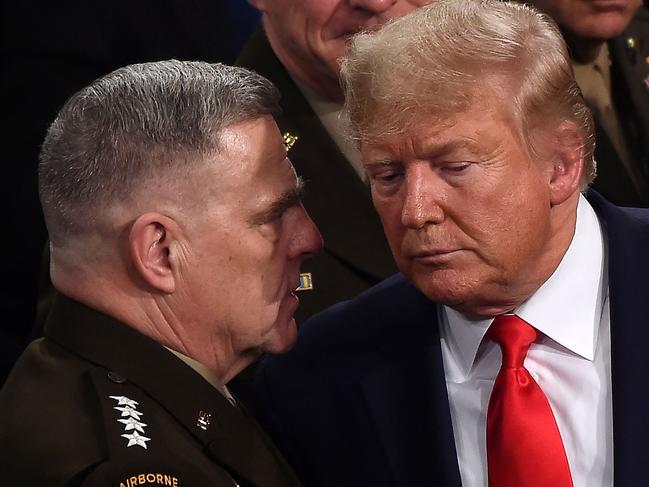 (FILES) In this file photo taken on February 04, 2020, Chairman of the Joint Chiefs of Staff, Army General Mark Milley (L) chats with US President Donald Trump after he delivered the State of the Union address at the US Capitol in Washington, DC. - Milley said his calls to a Chinese counterpart were a normal part of his duties, after a new book reported he secretly contacted Beijing amid worries over Donald Trump's mental state. "His calls with the Chinese and others in October and January were in keeping with these duties and responsibilities conveying reassurance in order to maintain strategic stability," Milley's spokesman Colonel Dave Butler said in a statement. (Photo by Olivier DOULIERY / AFP)