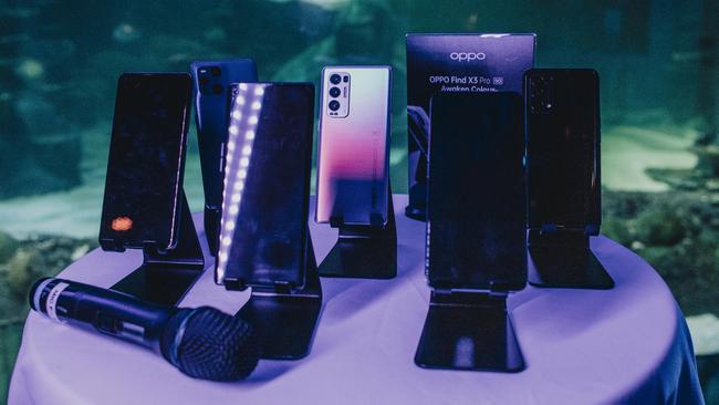 Oppo’s 2021 range of phones on show at Sydney aquarium. Picture: Maria Boyadgis